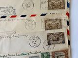 a pile of old envelopes sitting on a table