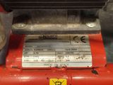 an image of a red machine with a label on it