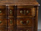 an antique chest of drawers with brass handles and drawers