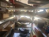 a room with a lot of shelves and boxes in it