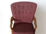 an image of a red chair against a white wall