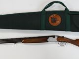 two shotguns and a shotgun case on a white surface