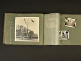 an open book with pictures of people and a flag on it