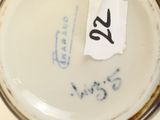 a jar with a sticker on it sitting on a table
