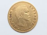 a gold coin with a picture of a woman on it
