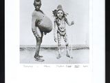black and white photograph of two children playing with a ball