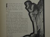 a black and white photo of a statue in a book