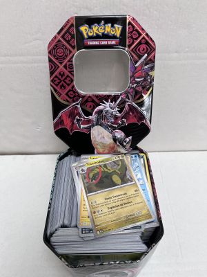 a close up of a box of pokemon trading cards on a table