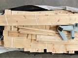 a pile of wood sitting on top of a plastic bag