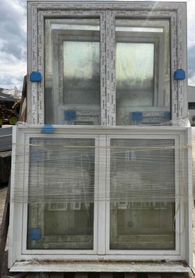 two windows that are sitting on top of a truck