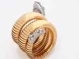 an image of a gold and diamond ring on a white background