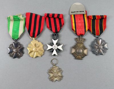 several medals and medals are displayed on a table