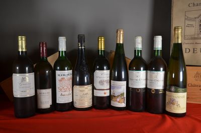 several bottles of wine are lined up on a table