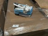 a box of toothbrushes sitting on top of a pile of boxes