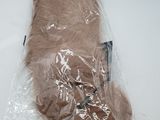a stuffed animal in a plastic bag on a table