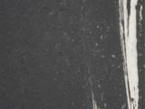 a black and white photo of a toothbrush with toothpaste on it