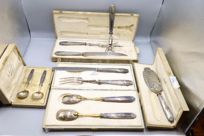 a lot of silverware in a box on a table