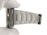a person holding a watch in their hand