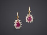 a pair of ruby and diamond earrings