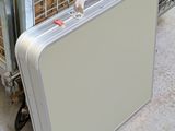 a suitcase that is sitting on the ground next to a cage