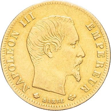 a close up of a gold coin with a man ' s face on it