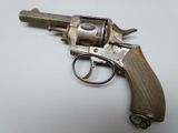 an old gun that is sitting on a table