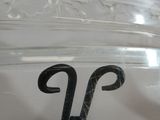 a glass jar with a pair of scissors in it