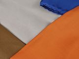 three different colors of fabric on top of each other