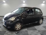 a picture of a small black car on a checkered floor