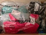 a box of underwear and a pair of shoes in it