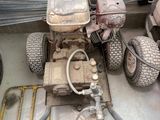 an image of a lawn mower sitting in a garage