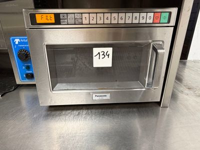 an image of a stainless steel oven with a price tag on it