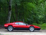 a red sports car parked in the middle of the woods