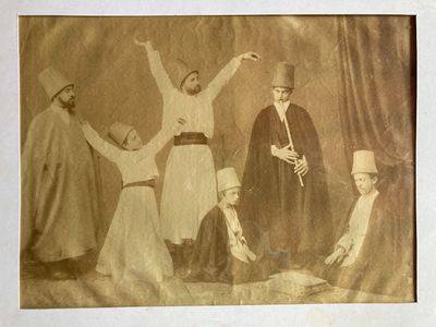 an old photo of a group of people posing for a picture