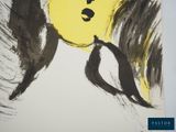a drawing of a woman ' s face on a piece of paper