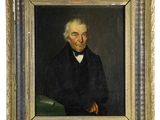 portrait of a man in a black coat and bow tie