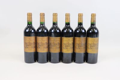 six bottles of red wine are lined up in a row