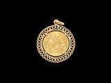 a close up of a gold coin on a black background
