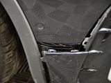 a close up of a car ' s front door with the door handle missing