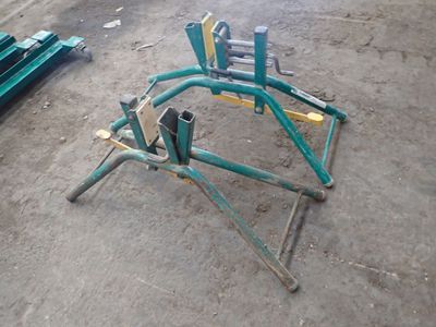 a broken chair sitting on the ground in the dirt