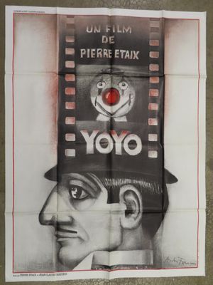 movie poster of a man with a top hat and a red heart on his head