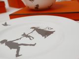 a plate with a drawing of a man and a woman on it