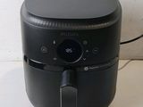 an image of a black air fryer sitting on top of a counter