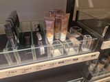 a display case with cosmetics products on it in a store