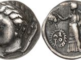 a close up of a coin with an image of a woman on it