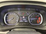 a close up of a car dashboard with various gauges
