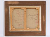 an old picture of a picture frame with writing on it