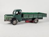 a green toy truck with a man inside of it