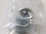 a bag with two silver and blue cupcakes inside of it
