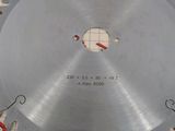 a close up of a circular saw blade on top of a piece of paper